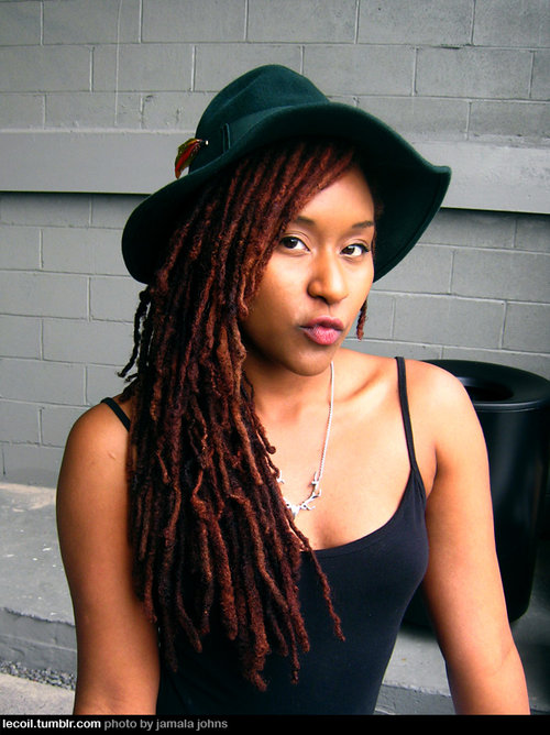 long red dreadlocks with a hat