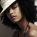 Jessi M'Bengue black natural hair model wearing a hat