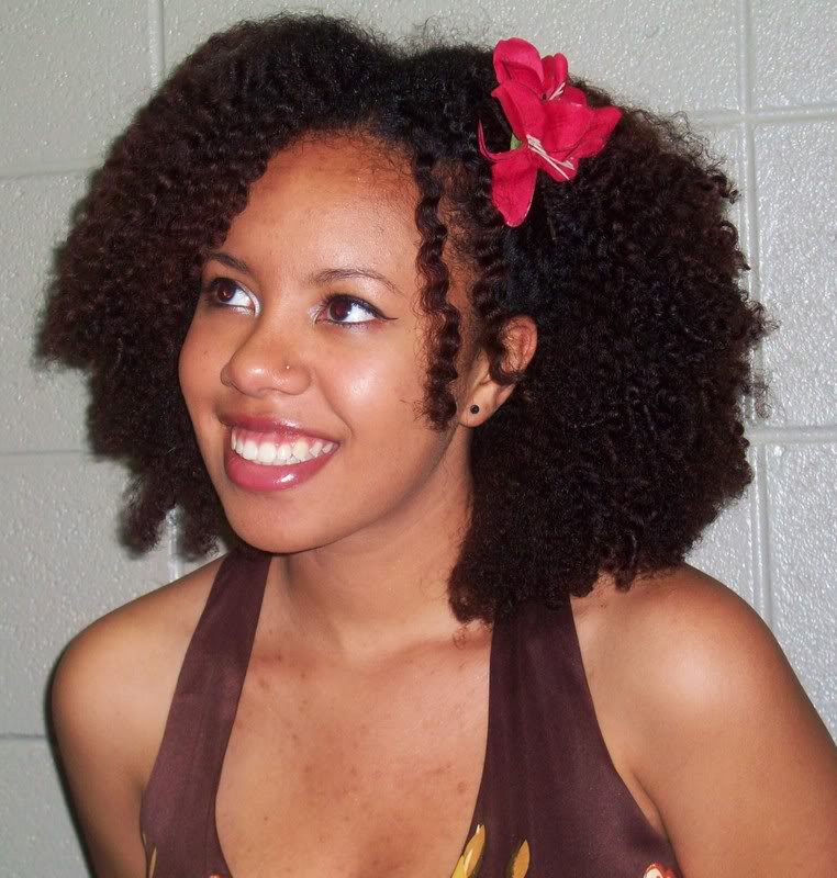 natural curly hair with flower - thirstyroots.com: Black Hairstyles
