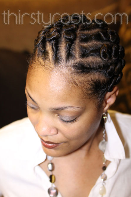 This flat twist bun hairstyle is ideal for a transitioning to natural 