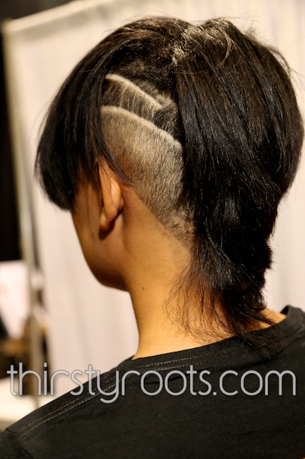 Haircut with parts on black woman