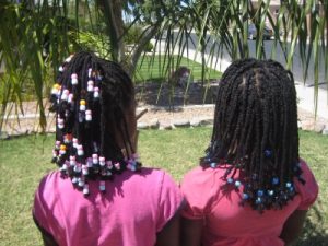 Braids with beads hairstyle back view African American 