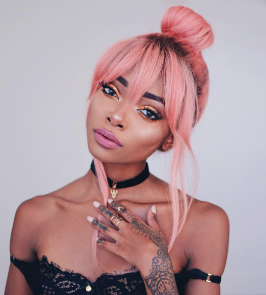 pastel-pink-hair-top-knot-hairstyle-with-bangs